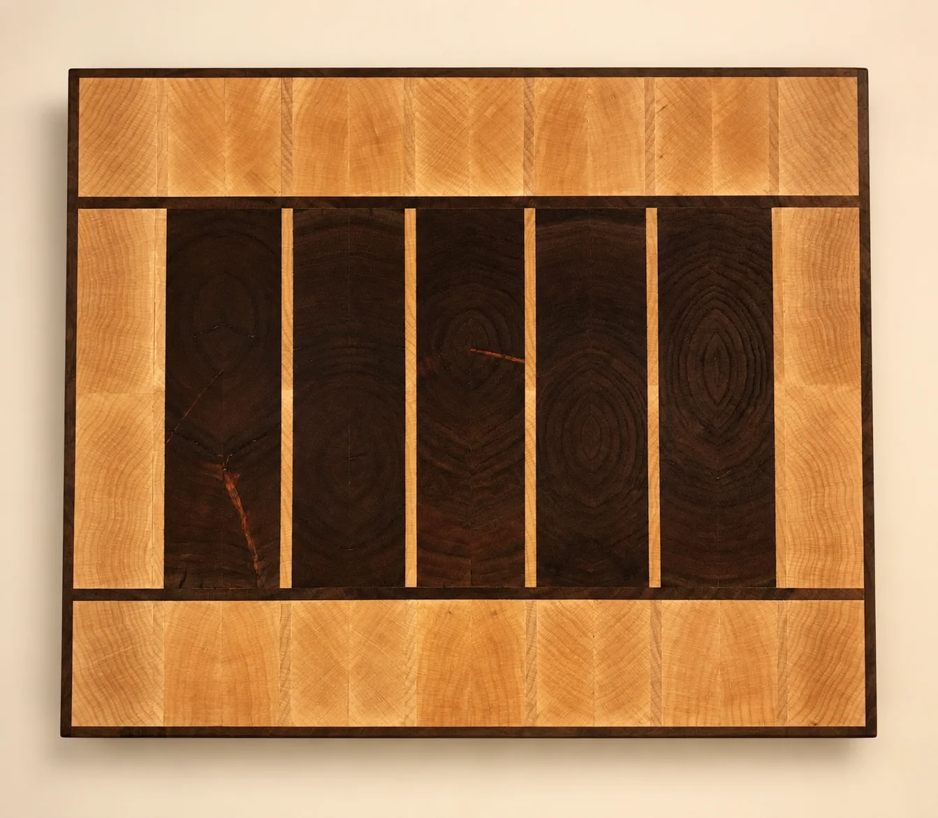 Rectangular heirloom cutting board with a dark center and light hardwood border