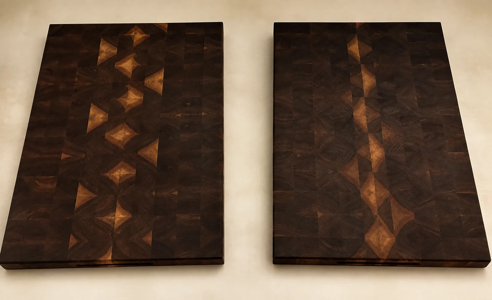 Two matching dark walnut end-grain boards with geometric grain patterns