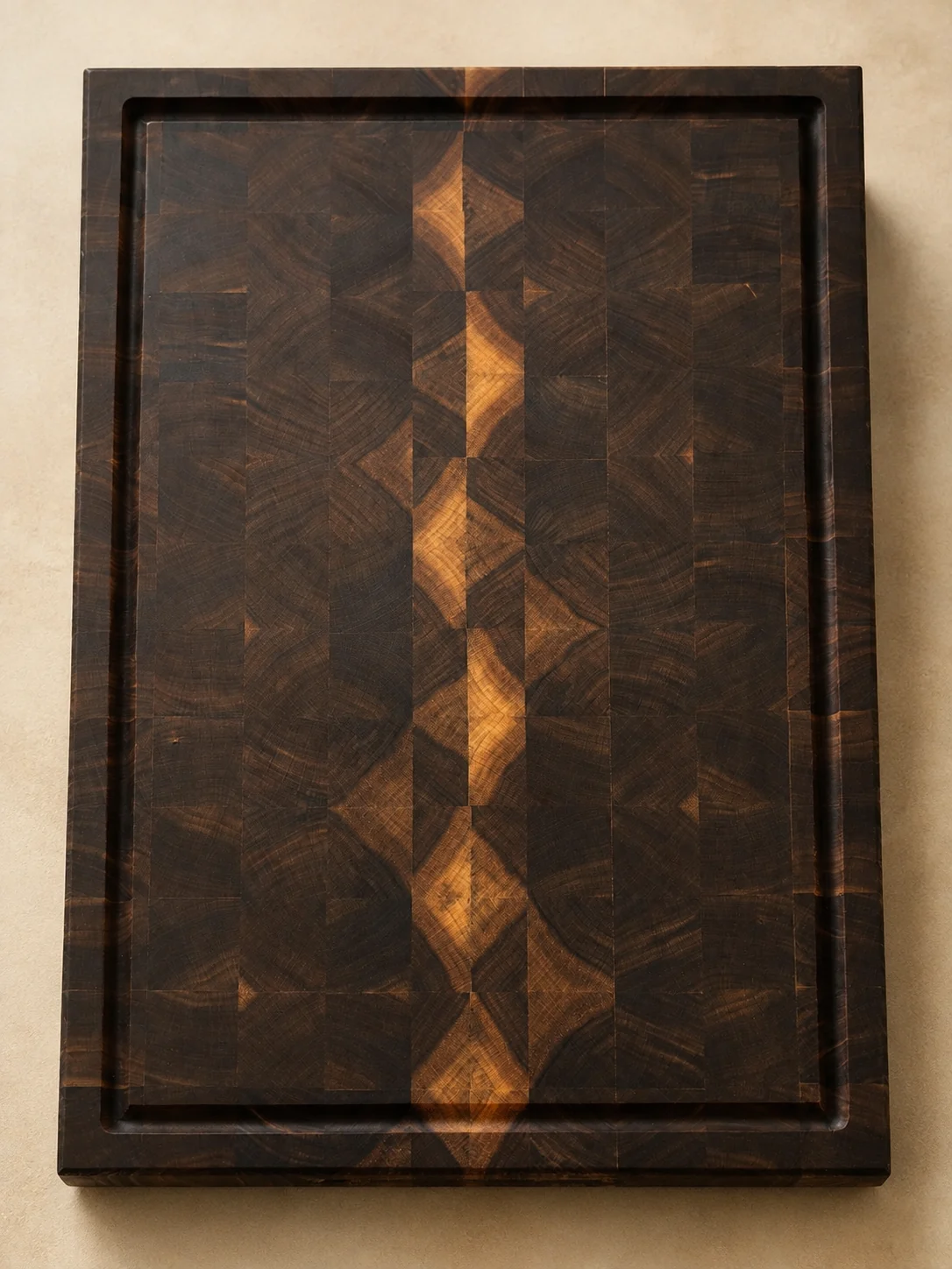 Dark walnut end-grain chef board with a geometric center pattern