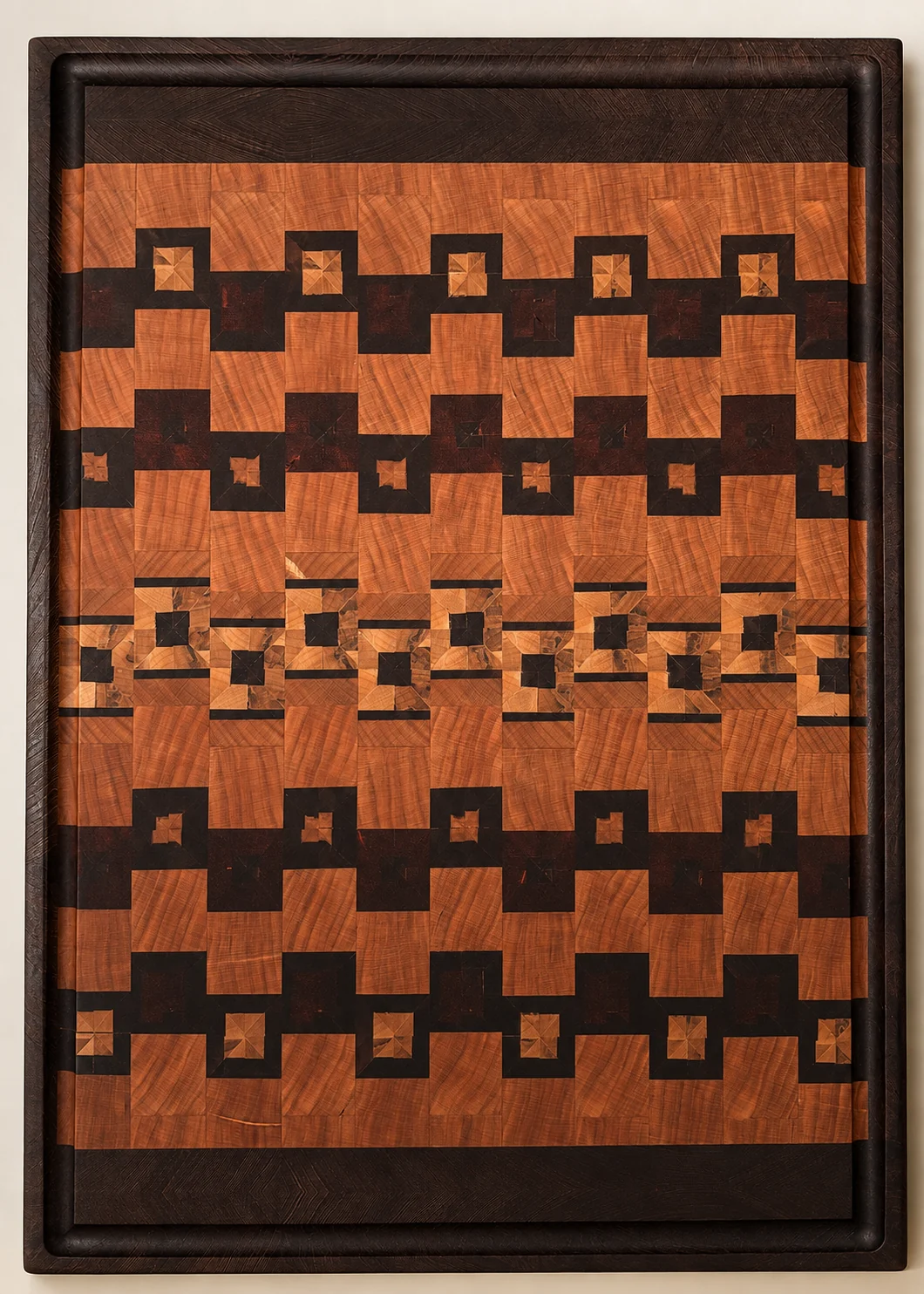 Portrait of a framed end-grain board with architectural geometric motifs