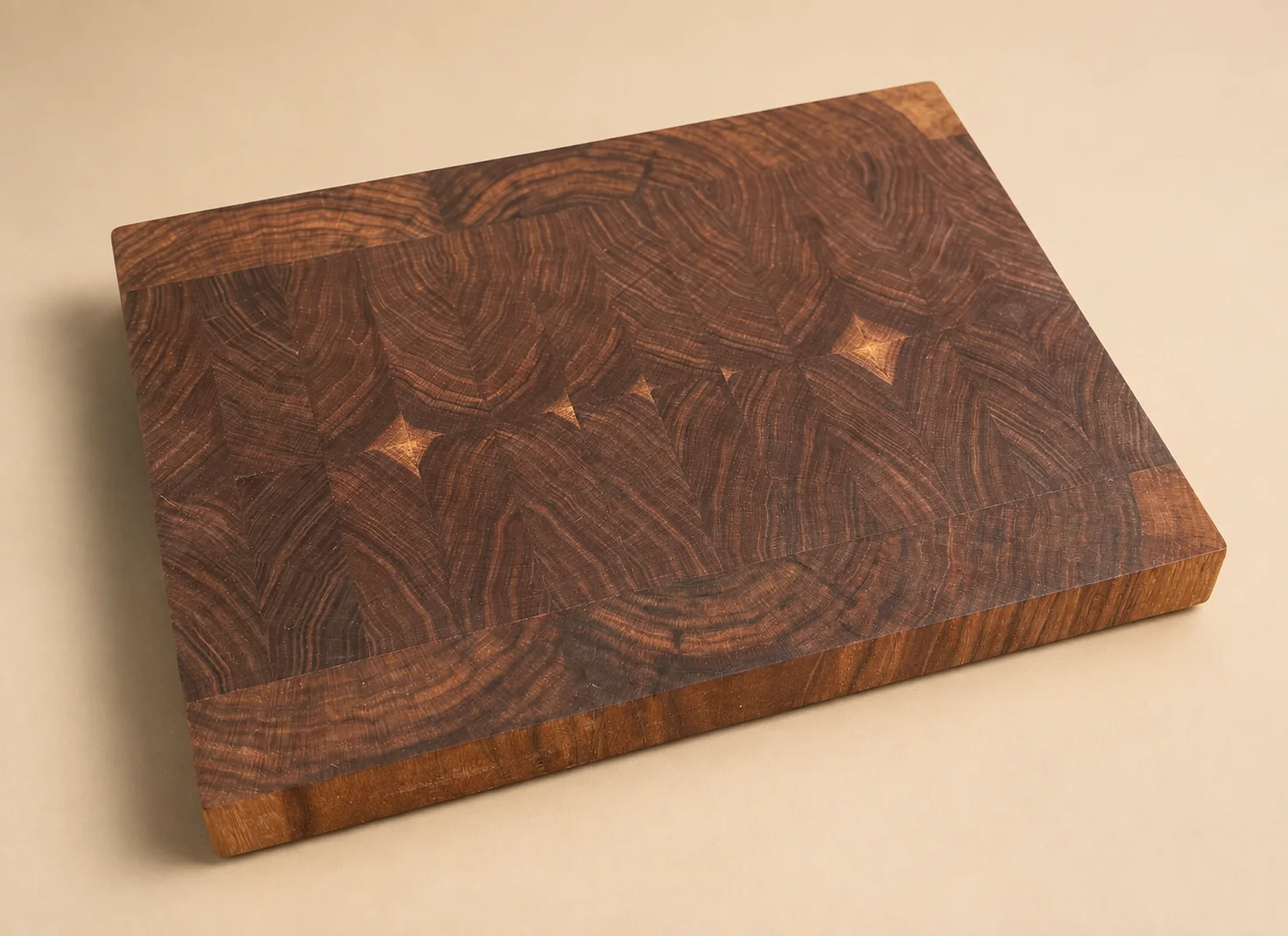Compact walnut end-grain preparation board with subtle geometric inlays