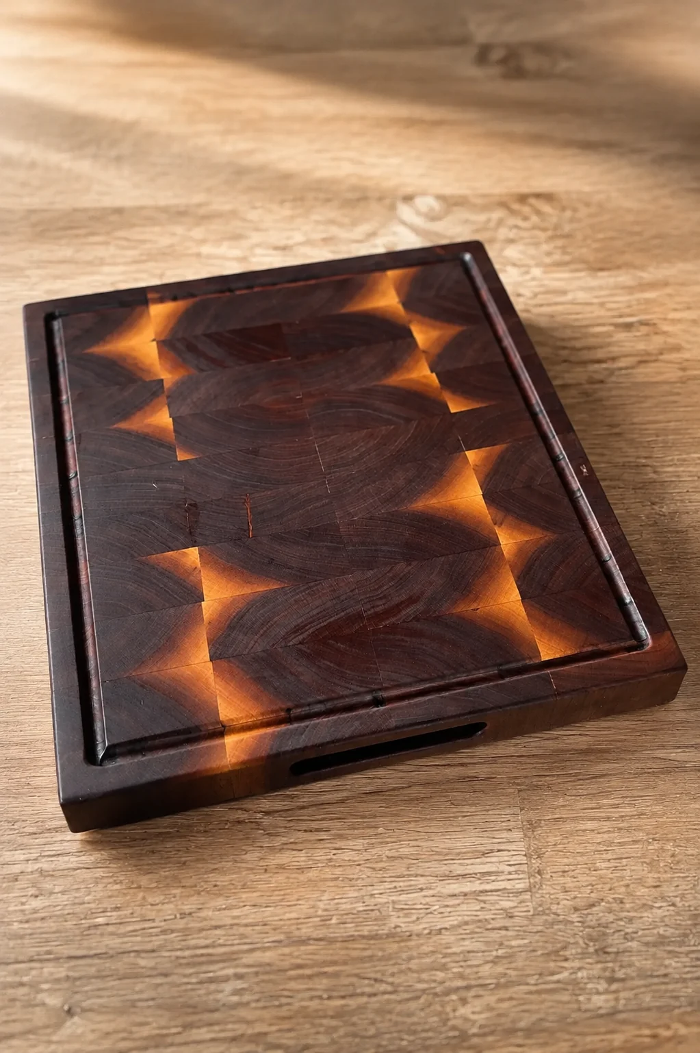 Walnut end-grain cutting board with a flame-like maple pattern
